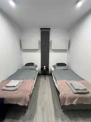 Łóżko lub łóżka w pokoju w obiekcie Apartament Centrum Kłodnicka