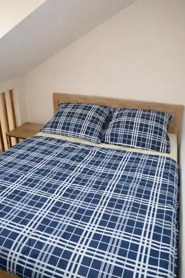 Łóżko lub łóżka w pokoju w obiekcie Apartments Rajska 77