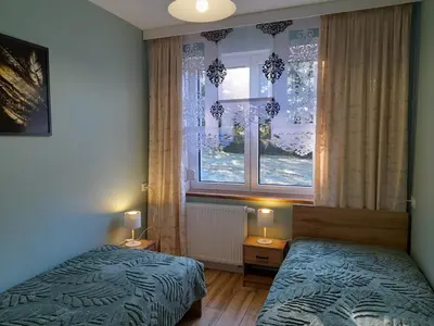 Łóżko lub łóżka w pokoju w obiekcie Apartamenty u Bodzia 3