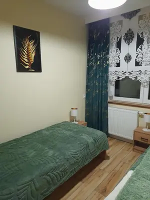 Łóżko lub łóżka w pokoju w obiekcie Apartamenty u Bodzia 3