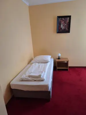 Łóżko lub łóżka w pokoju w obiekcie Hotel Malwa