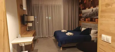 Łóżko lub łóżka w pokoju w obiekcie Apartament Czarna Góra Blue