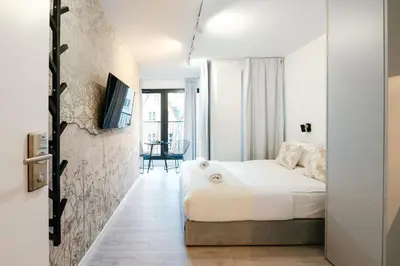 Łóżko lub łóżka w pokoju w obiekcie Nowy Targ Jodłowa by Comfort Apartments
