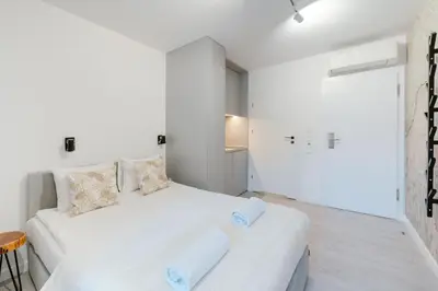 Łóżko lub łóżka w pokoju w obiekcie Nowy Targ Jodłowa by Comfort Apartments