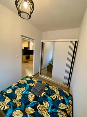 Łóżko lub łóżka w pokoju w obiekcie Apartament Krokus - winda, parking