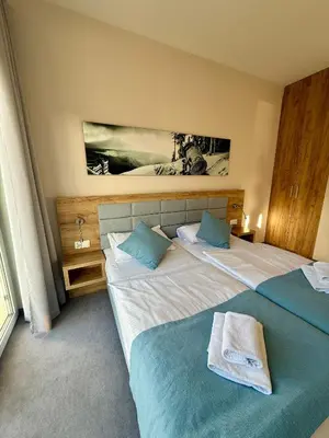 Łóżko lub łóżka w pokoju w obiekcie Aparthotel Apartamentu Czarna Góra 121