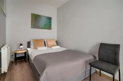 Łóżko lub łóżka w pokoju w obiekcie RentPlanet - Studio Kościuszki