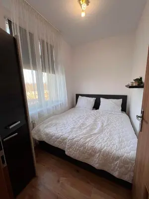 Łóżko lub łóżka w pokoju w obiekcie Home & Pool Apartment