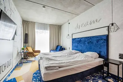 Łóżko lub łóżka w pokoju w obiekcie VacationClub - Biała Perła Apartament 301
