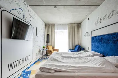 Łóżko lub łóżka w pokoju w obiekcie VacationClub - Biała Perła Apartament 301