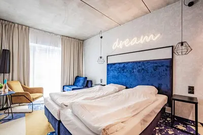 Łóżko lub łóżka w pokoju w obiekcie VacationClub - Biała Perła Apartament 301