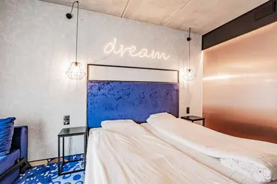 Łóżko lub łóżka w pokoju w obiekcie VacationClub - Biała Perła Apartament 301