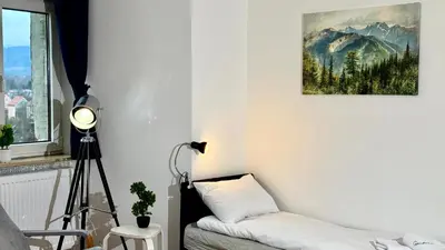Łóżko lub łóżka w pokoju w obiekcie Apartamenty w Starej Wieży by LibertaRent