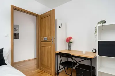 Łóżko lub łóżka w pokoju w obiekcie Spacious Apartment in Wrocław with Large Terrace and 2 Parking Spaces by Noclegi Renters