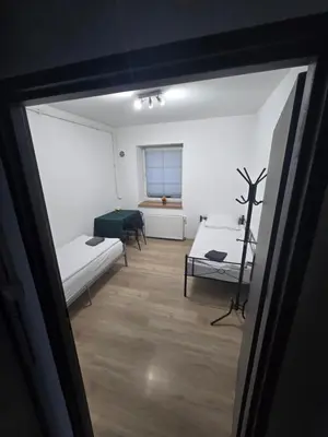 Łóżko lub łóżka w pokoju w obiekcie Apartament Wrocławska 11