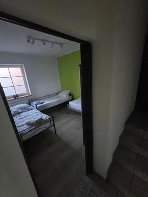 Łóżko lub łóżka w pokoju w obiekcie Apartament Wrocławska 11