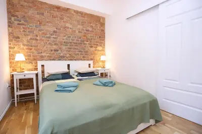 Łóżko lub łóżka w pokoju w obiekcie Apartament na Starówce