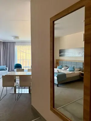 Łóżko lub łóżka w pokoju w obiekcie Aparthotel Apartamenty Czarna Góra 111