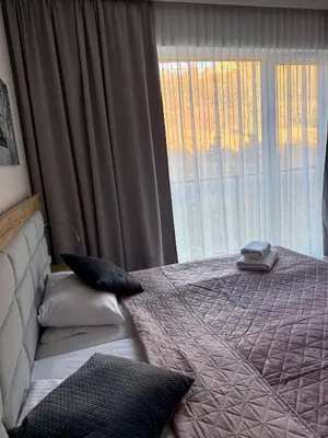 Łóżko lub łóżka w pokoju w obiekcie Aparthotel Apartamenty Czarna Góra 204