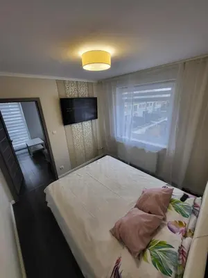 Łóżko lub łóżka w pokoju w obiekcie Apartament Daisy 2