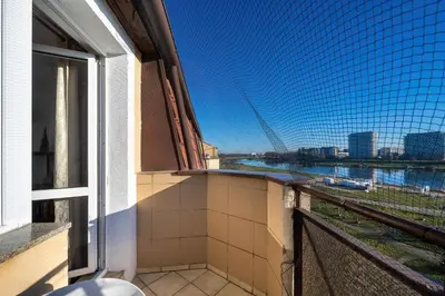 Balkon lub taras w obiekcie Bright & Spacious Apartment for 6 People with the River View by Noclegi Reenters