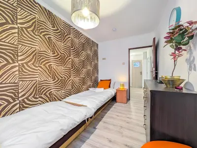 Łóżko lub łóżka w pokoju w obiekcie Powstańców Śląskich Homely Apartment by BookingHost