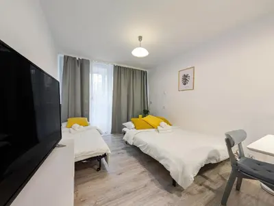 Łóżko lub łóżka w pokoju w obiekcie Powstańców Śląskich Homely Apartment by BookingHost