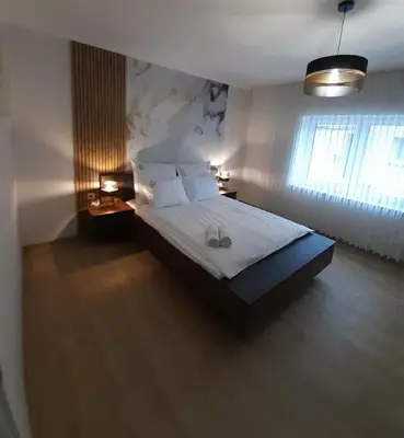 Łóżko lub łóżka w pokoju w obiekcie Apartament w Czarnowąsach 3