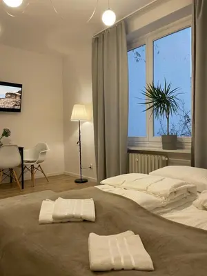 Łóżko lub łóżka w pokoju w obiekcie Apartament przy Sądzie