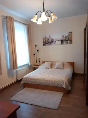 Łóżko lub łóżka w pokoju w obiekcie Studio Szczawienko 2
