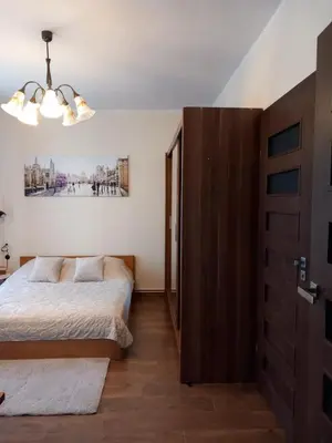 Łóżko lub łóżka w pokoju w obiekcie Studio Szczawienko 2