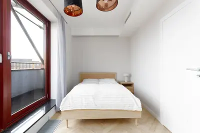 Łóżko lub łóżka w pokoju w obiekcie Apartamenty Krawiecka, Sun & Snow
