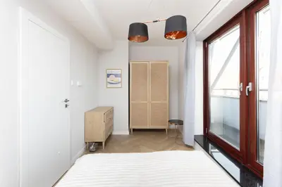 Łóżko lub łóżka w pokoju w obiekcie Apartamenty Krawiecka, Sun & Snow