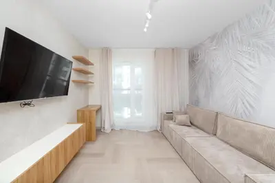 Telewizja i/lub zestaw kina domowego w obiekcie Kawalerka z balkonem na Sylwestra w super lokalizacji