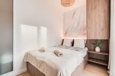 Łóżko lub łóżka w pokoju w obiekcie Legnicka Residence Adam i Ela