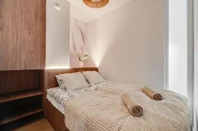 Łóżko lub łóżka w pokoju w obiekcie Legnicka Residence Adam i Ela