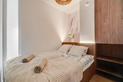 Łóżko lub łóżka w pokoju w obiekcie Legnicka Residnce 17B Adam i Ela