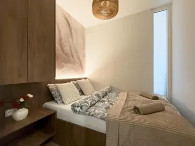 Łóżko lub łóżka w pokoju w obiekcie Legnicka Residence 18 A