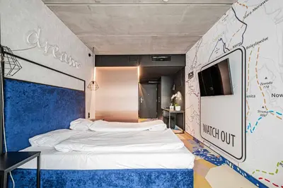 Łóżko lub łóżka w pokoju w obiekcie VacationClub Biała Perła Apartament 509