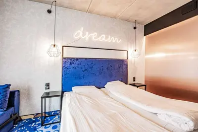 Łóżko lub łóżka w pokoju w obiekcie VacationClub Biała Perła Apartament 603