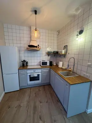 Kuchnia lub aneks kuchenny w obiekcie KatyHome Legnica