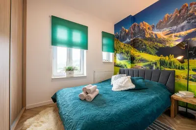 Łóżko lub łóżka w pokoju w obiekcie Apartament Gwiazd