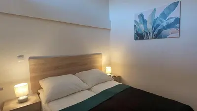 Łóżko lub łóżka w pokoju w obiekcie Apartament Pierwszy Maj