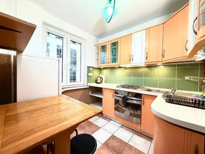 Kuchnia lub aneks kuchenny w obiekcie Kilińskiego Urban Apartment by BookingHost