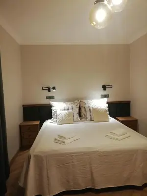Łóżko lub łóżka w pokoju w obiekcie Apartamenty Mirabelka