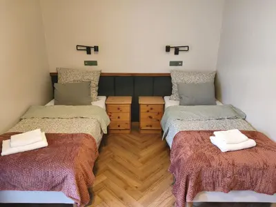 Łóżko lub łóżka w pokoju w obiekcie Apartamenty Mirabelka