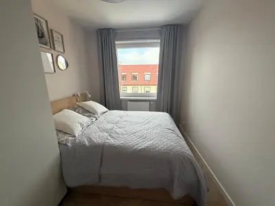 Łóżko lub łóżka w pokoju w obiekcie Apartament Przy Palmiarni