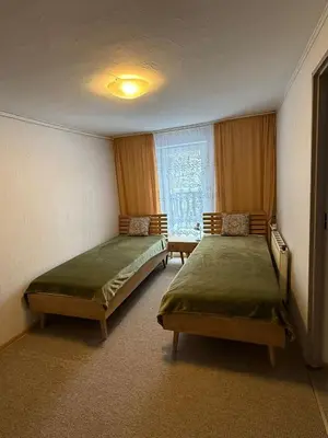 Łóżko lub łóżka w pokoju w obiekcie Agroturystyka Dom pod Kalenicą