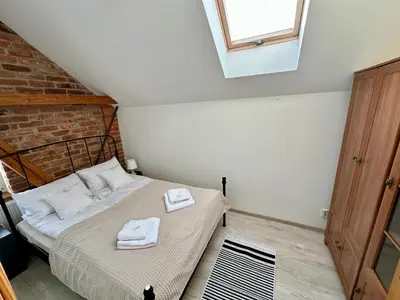 Łóżko lub łóżka w pokoju w obiekcie Atrakcyjny apartament z widokiem - Góry Sowie - Bielawa