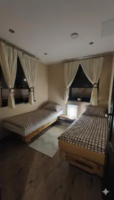 Łóżko lub łóżka w pokoju w obiekcie Apartament u Hillów